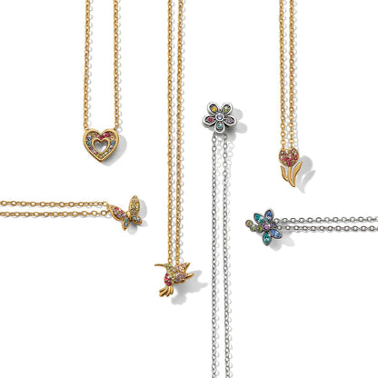 Brighton necklaces styled with silver-plated and gold-tone pendants featuring crystal heart, butterfly, hummingbird, and flower charms
