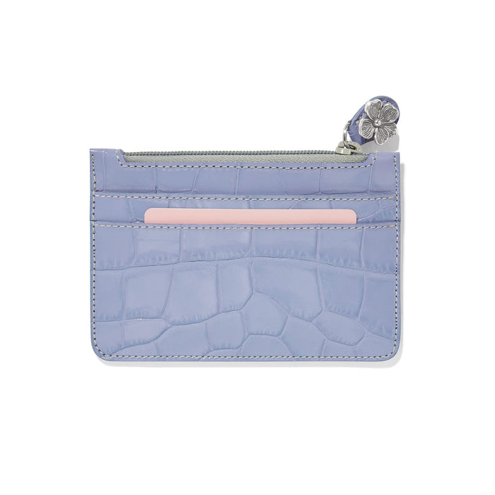Brighton card case in lavender croc-embossed leather with zip top and silver-tone flower charm on a white background