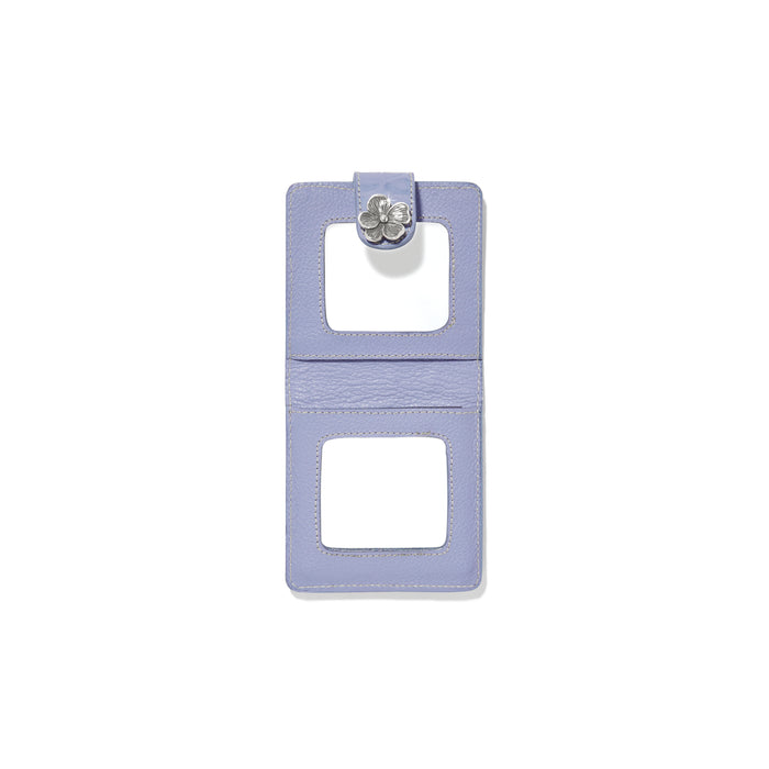 Brighton bifold card case shown open in lavender leather with silver-tone flower snap closure on a white background