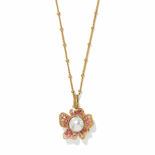 Brighton pendant necklace with gold-plated flower, glass pearl center, and pink crystal petals on a white background