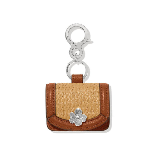 Brighton bag charm in brown leather and faux straw with silver-tone flower and clip on a white background