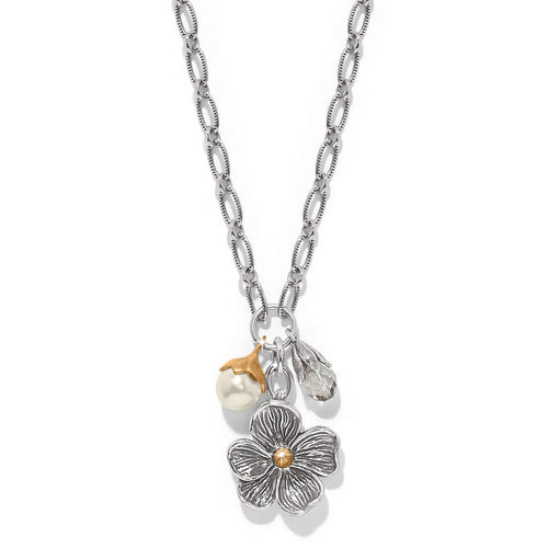 Brighton pendant necklace with silver-tone flower, glass pearl, and crystal bead charms in two-tone finish on a white background