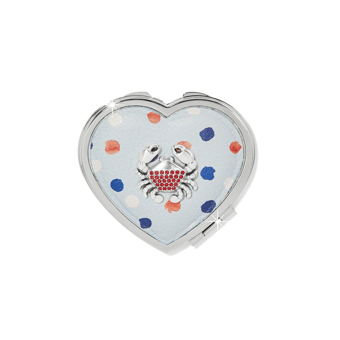 Brighton heart-shaped compact mirror with light blue polka dot design and red crystal crab accent on a white background