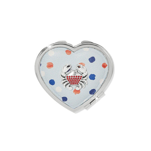 Brighton heart-shaped compact mirror with light blue polka dot design and red crystal crab accent on a white background