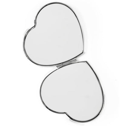 Brighton heart-shaped compact mirror shown open with silver-tone frame and dual mirror panels on a white background