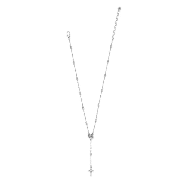 Brighton rosary necklace with silver-plated chain, crystal beads, round medallion, and crucifix drop on a white background