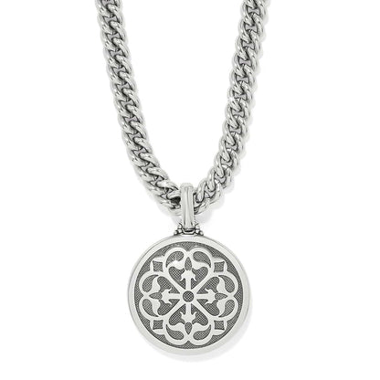 Brighton pendant necklace with silver-plated openwork medallion and curb chain on a white background