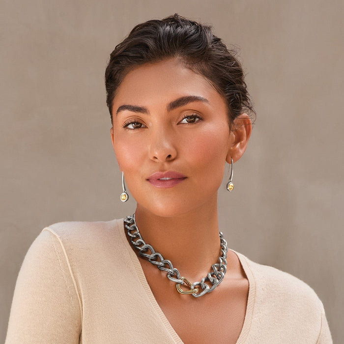 Model wearing Brighton two-tone chunky curb chain necklace with gold link accent paired with silver drop earrings