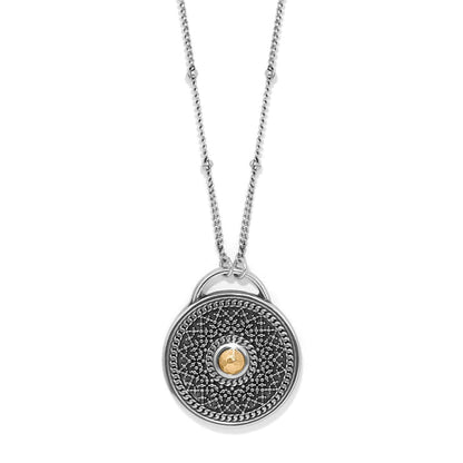 Brighton pendant necklace with two-tone medallion, silver beaded chain, and gold hammered center accent on a white background