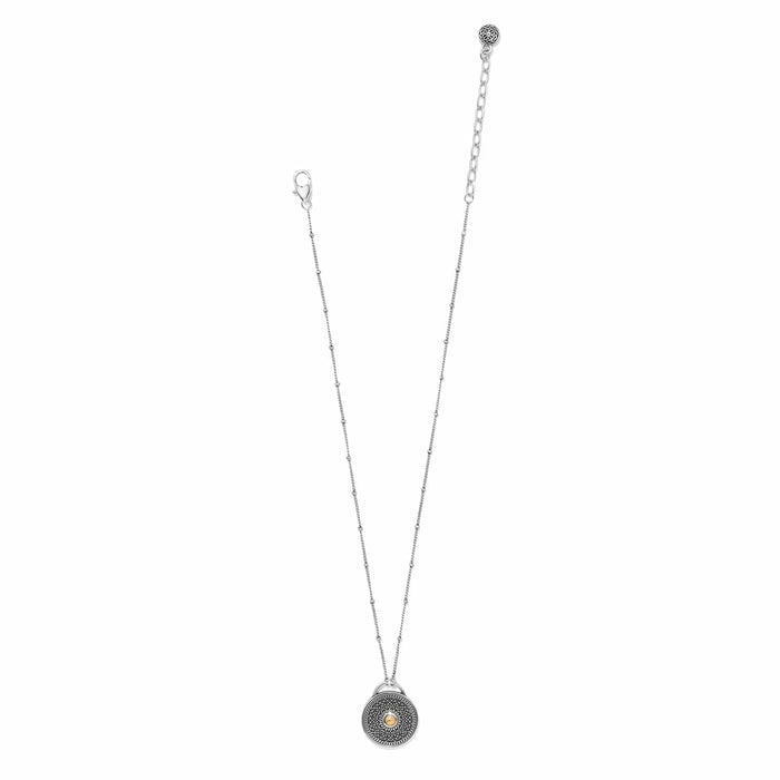 Brighton pendant necklace with two-tone round medallion, beaded chain, and lobster clasp on a white background