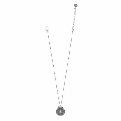 Brighton pendant necklace with two-tone round medallion, beaded chain, and lobster clasp on a white background
