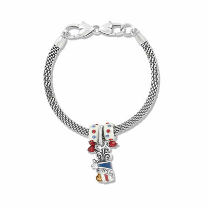 Brighton silver-plated mesh charm bracelet with red, white, and blue enamel beads and patriotic pendant on a white background