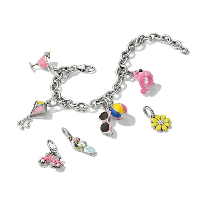 Brighton silver-plated charm bracelet styled with enamel summer-themed charms including flamingo, beach ball, and flower on white background