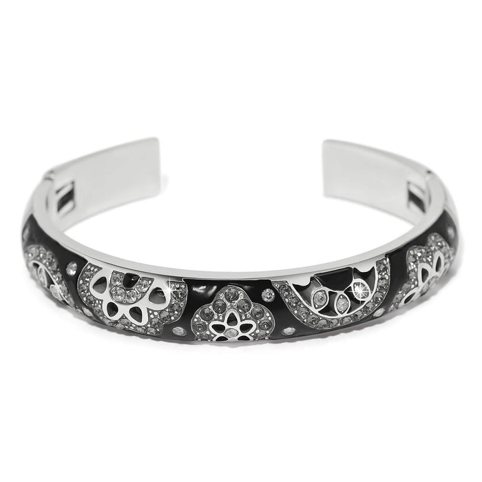 Brighton cuff bracelet with black enamel, silver-plated floral motifs, and crystal accents on a white background