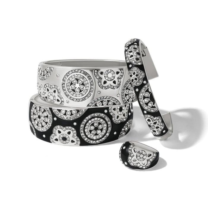 Brighton silver-plated bangles and ring set with black and white enamel and crystal floral medallions on a white background