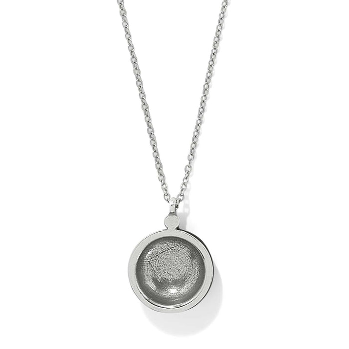 Brighton pendant necklace with round silver-plated medallion and recessed center on delicate chain on a white background
