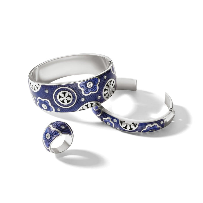 Brighton bangle bracelets and ring set with blue enamel, floral motifs, crystals, and silver-plated finish on a white background