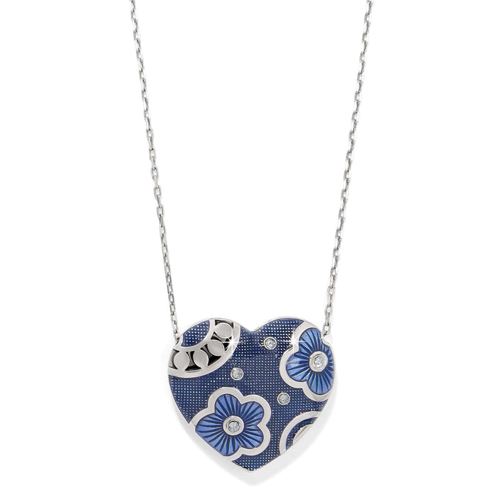 Brighton heart pendant necklace with blue enamel floral design, crystal accents, and silver-plated chain on a white background