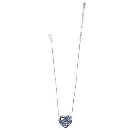Brighton heart pendant necklace with blue enamel floral design, crystal accents, and silver-plated chain on a white background