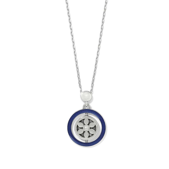 Brighton pendant necklace with silver-plated medallion, blue enamel ring, and crystal accents on a white background