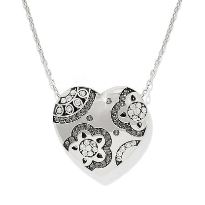 Brighton heart pendant necklace with silver-plated finish and crystal floral motifs on a white background