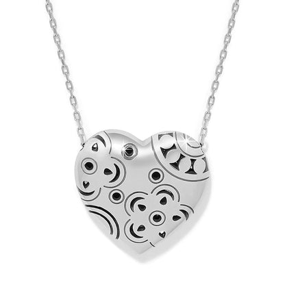 Brighton heart pendant necklace with silver-plated finish and engraved swirl pattern on a white background