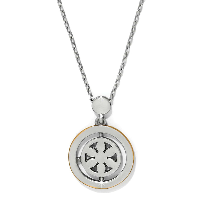 Brighton pendant necklace with two-tone circular medallion featuring openwork cross design and silver-tone chain on a white background