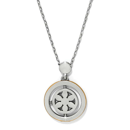 Brighton pendant necklace with two-tone circular medallion featuring openwork cross design and silver-tone chain on a white background