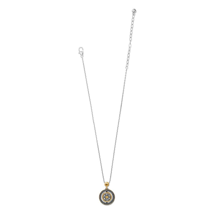 Brighton pendant necklace with two-tone circular medallion, crystal accents, and silver-tone chain on a white background
