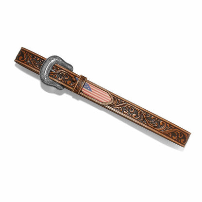 Brighton leather belt with tooled scrollwork, American flag inlay, and engraved silver-tone buckle on a white background