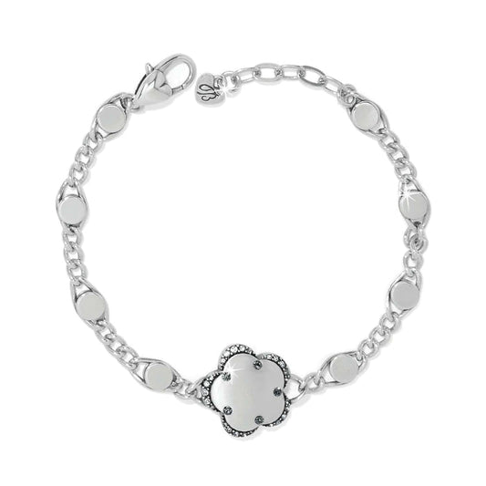 Brighton silver-plated bracelet with floral charm, crystal accents, and disc-link chain on a white background
