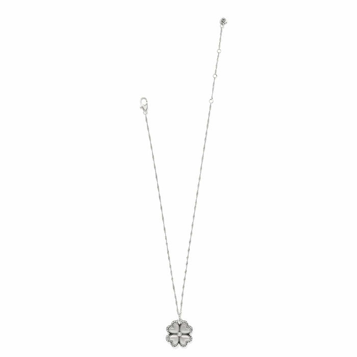 Brighton silver-plated pendant necklace with crystal-trimmed four-leaf clover charm and twisted chain on a white background