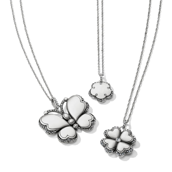 Brighton silver-plated pendant necklaces featuring butterfly and flower designs with crystal accents on a white background