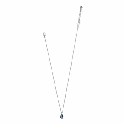 Brighton silver-plated heart pendant necklace with blue crystal and enamel accent shown with adjustable chain on a white background