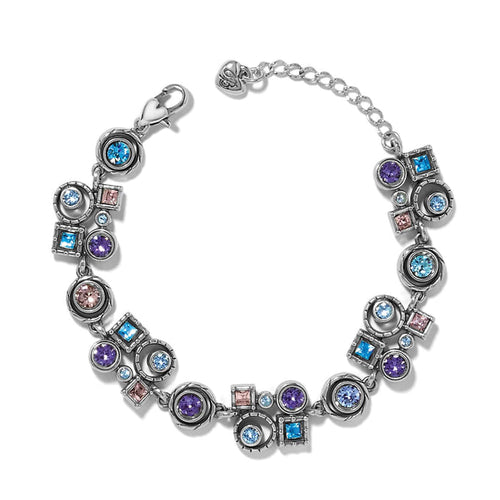 Brighton bracelet with blue, purple, and pink crystals in silver-plated circular and square settings on a white background