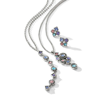 Brighton silver-plated necklaces and earrings styled together with multicolored crystals in round and square settings