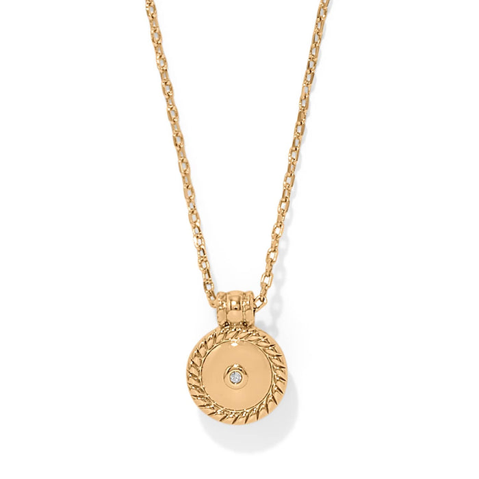 Brighton pendant necklace with gold-plated round medallion, rope-edge border, and center crystal accent on a white background