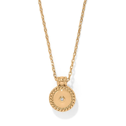 Brighton pendant necklace with gold-plated round medallion, rope-edge border, and center crystal accent on a white background