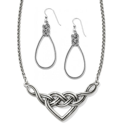 Brighton necklace with silver-tone Celtic knot heart pendant and matching teardrop knot earrings on a white background