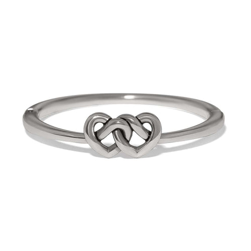 Brighton ring with silver-plated band featuring two interlocking heart motifs at the center on a white background