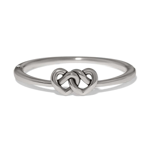 Brighton ring with silver-plated band featuring two interlocking heart motifs at the center on a white background