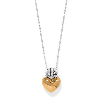 Brighton pendant necklace with gold-tone puffed heart and silver-tone chain in two-tone finish on a white background