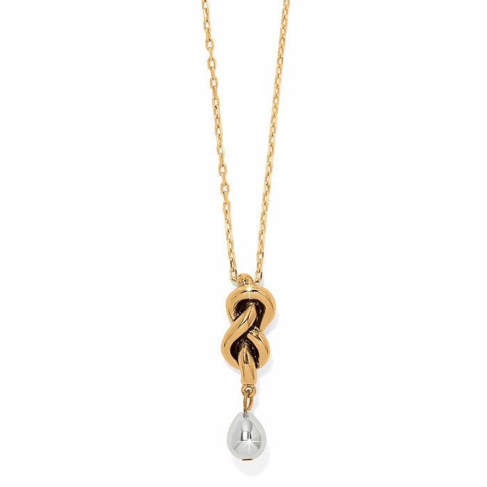 Brighton pendant necklace with gold-tone knot design and silver-tone teardrop accent on a white background