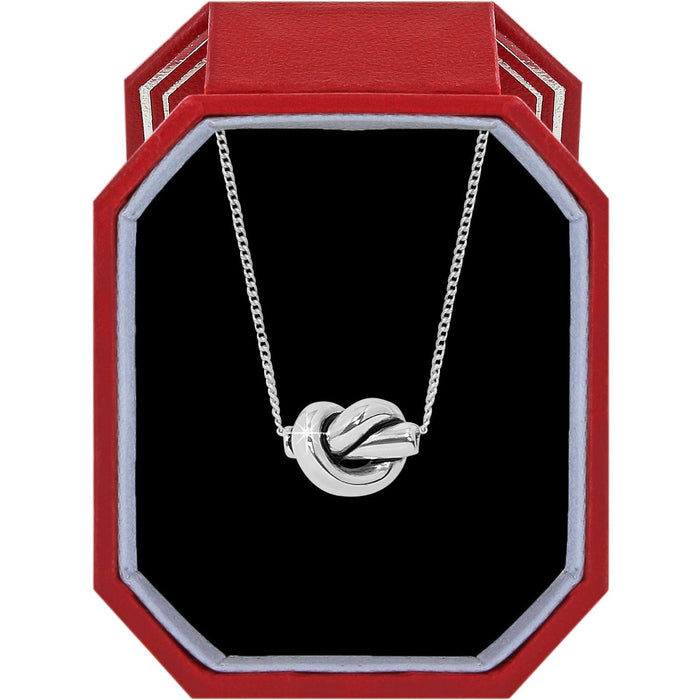 Brighton silver-plated knot pendant necklace displayed in a red octagonal gift box with black interior on a white background