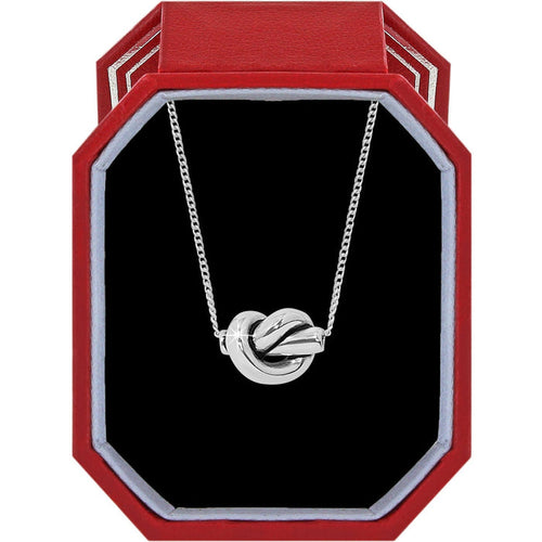 Brighton silver-plated knot pendant necklace displayed in a red octagonal gift box with black interior on a white background