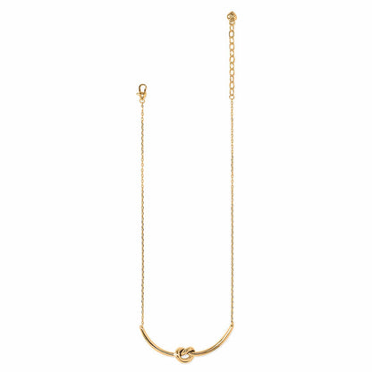 Brighton gold-plated necklace with curved bar pendant featuring a center knot detail and lobster clasp on a white background