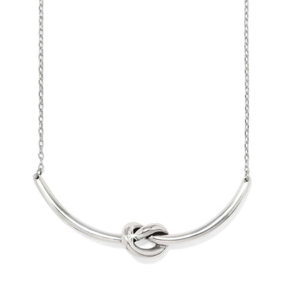 Brighton necklace with curved silver-tone bar featuring a center knot detail and delicate chain on a white background
