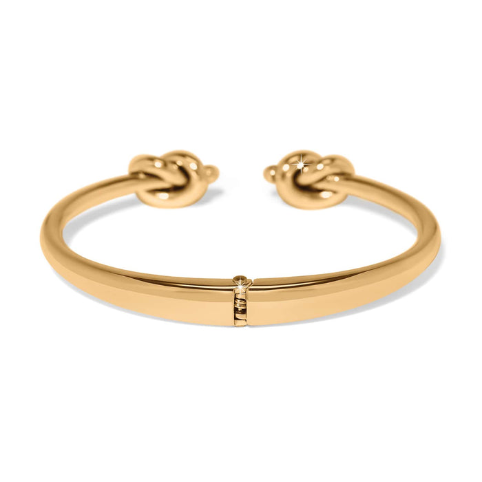 Brighton hinged cuff bracelet in gold-plated finish with double knot end caps on a white background