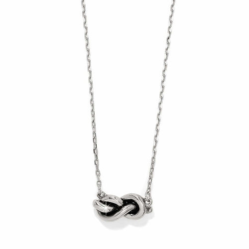 Brighton necklace with silver-tone infinity knot pendant on delicate chain on a white background
