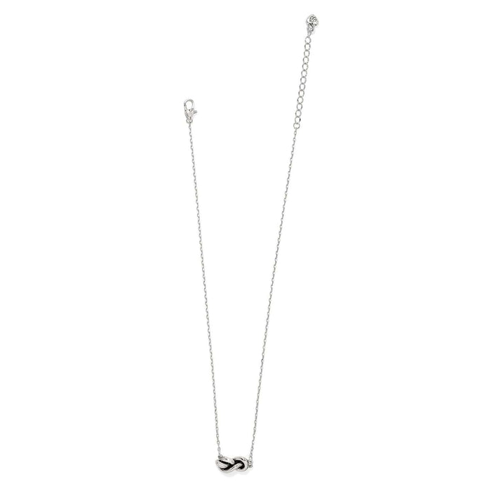 Brighton necklace with silver-tone knot pendant and delicate cable chain with lobster clasp on a white background